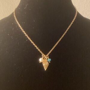 GoldPendant Necklace with Pearl and Turquoise Accents and a shell.